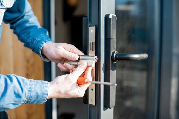 Skilled locksmith working on a broken lock