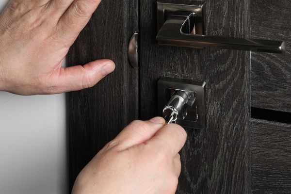 Locksmith repairing broken key stuck lock