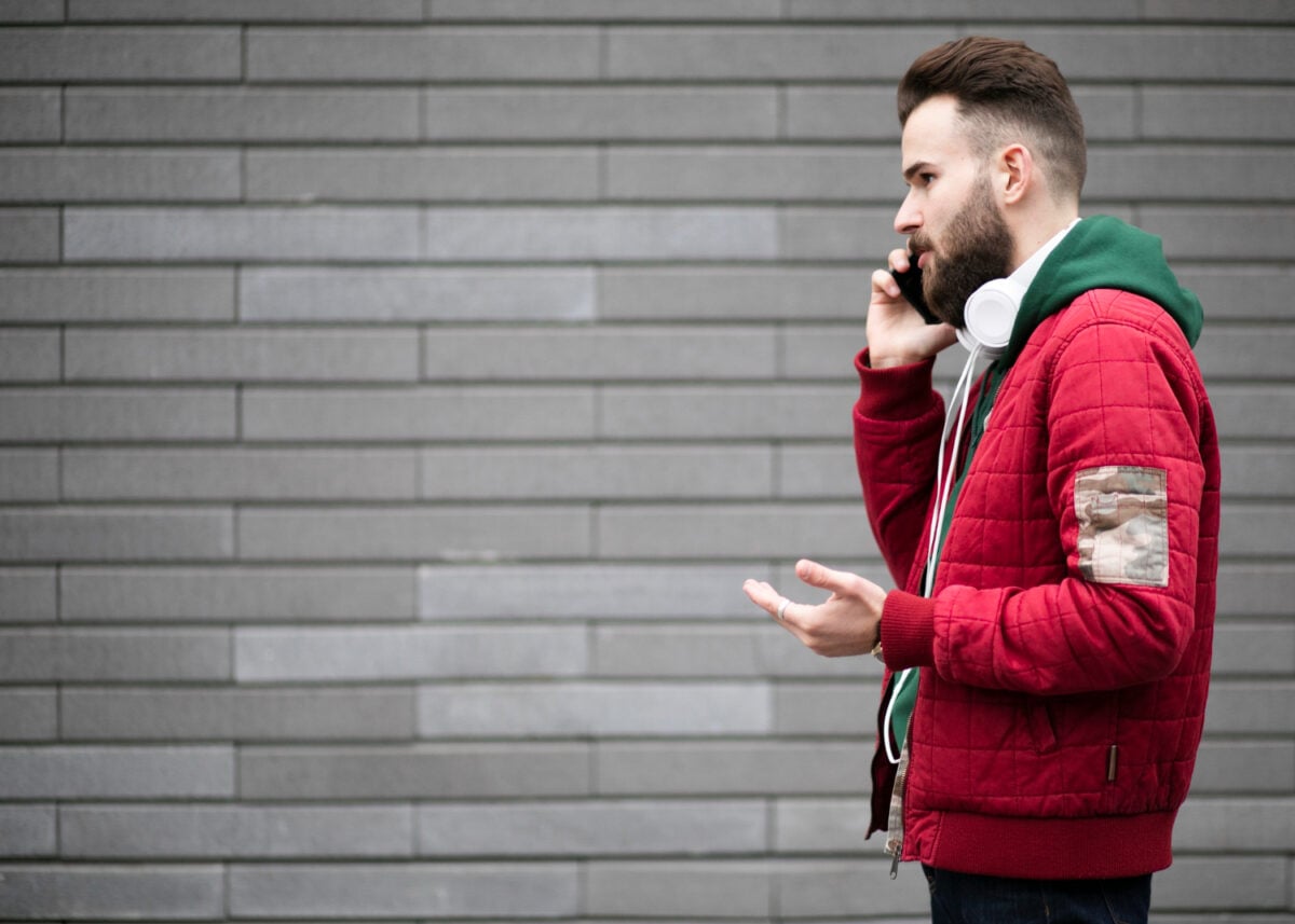 Man calling locksmith during lockout emergency