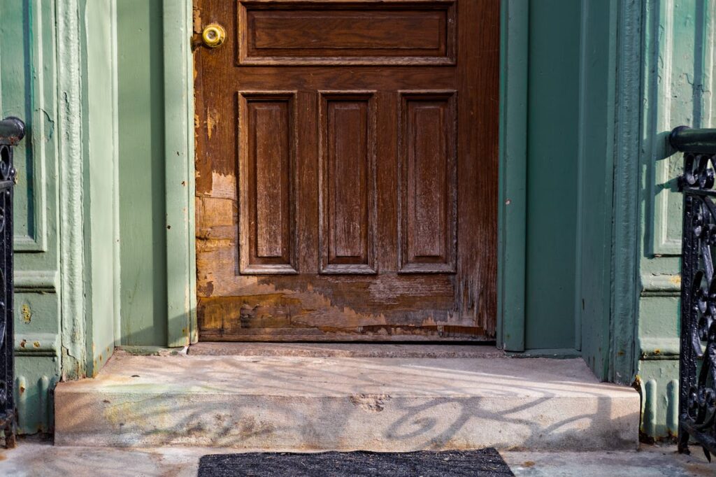 A damaged brown wooden door