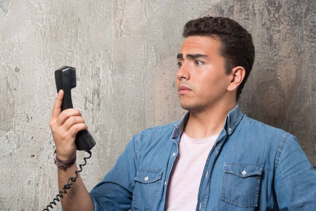 Man in distressed about to call a locksmith
